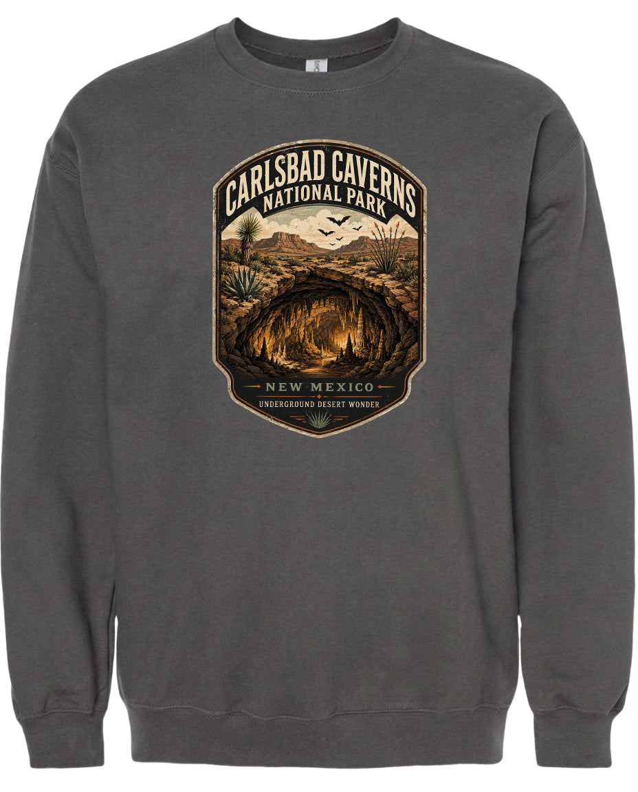 A gray sweatshirt with a graphic design depicting the Carlsbad Caverns National Park in New Mexico.
