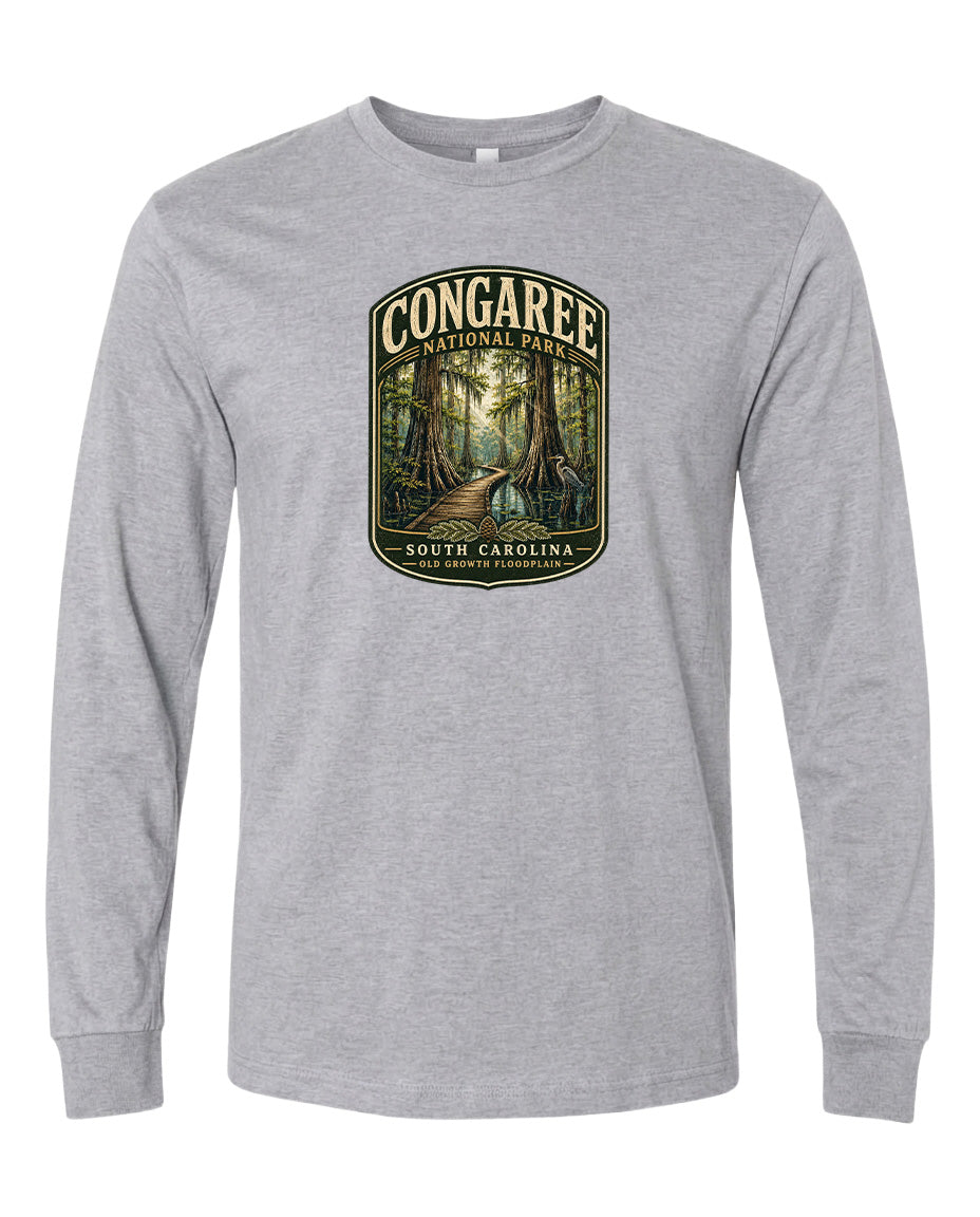 A gray long-sleeved t-shirt with a graphic design depicting a forest scene, featuring a path leading through the trees.