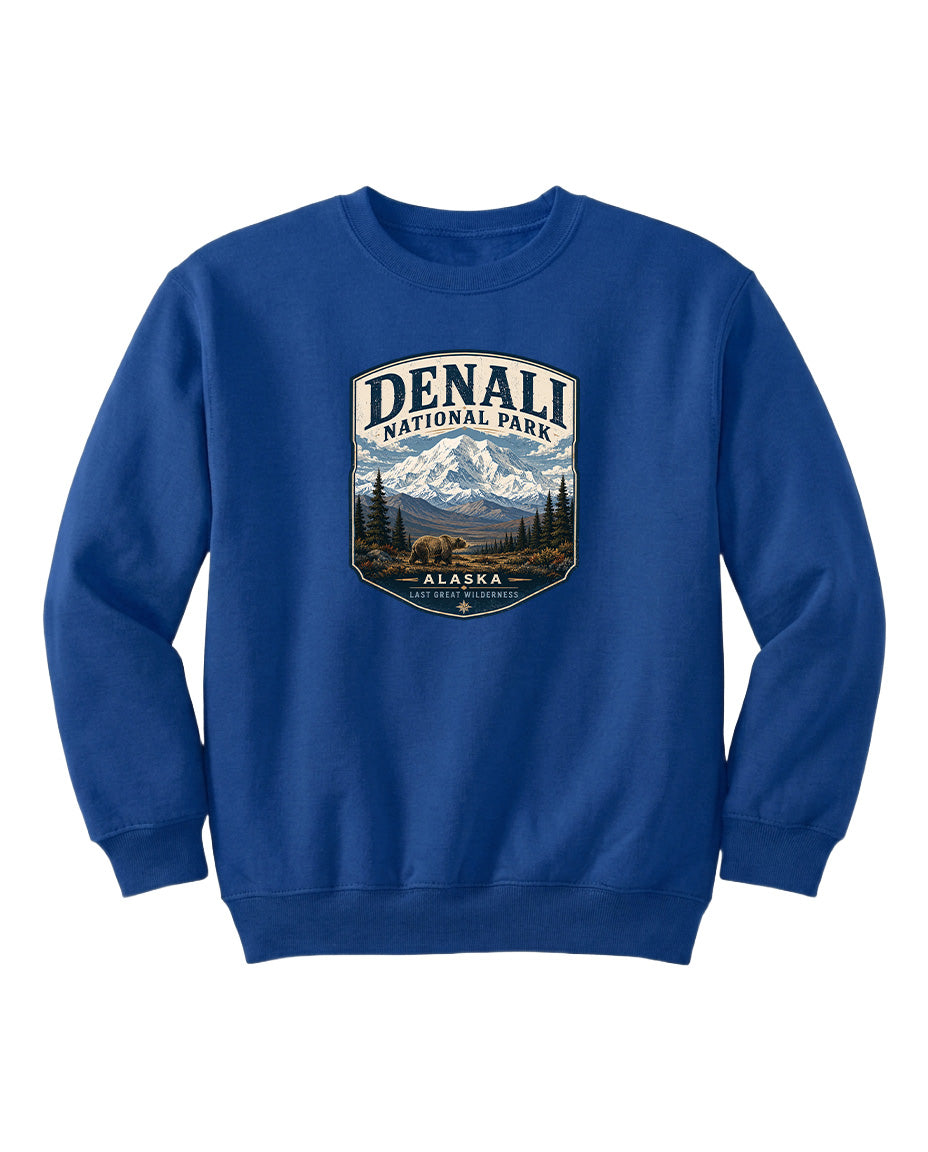 A blue sweatshirt with a graphic design featuring a mountain landscape and bears, representing Denali National Park in Alaska.