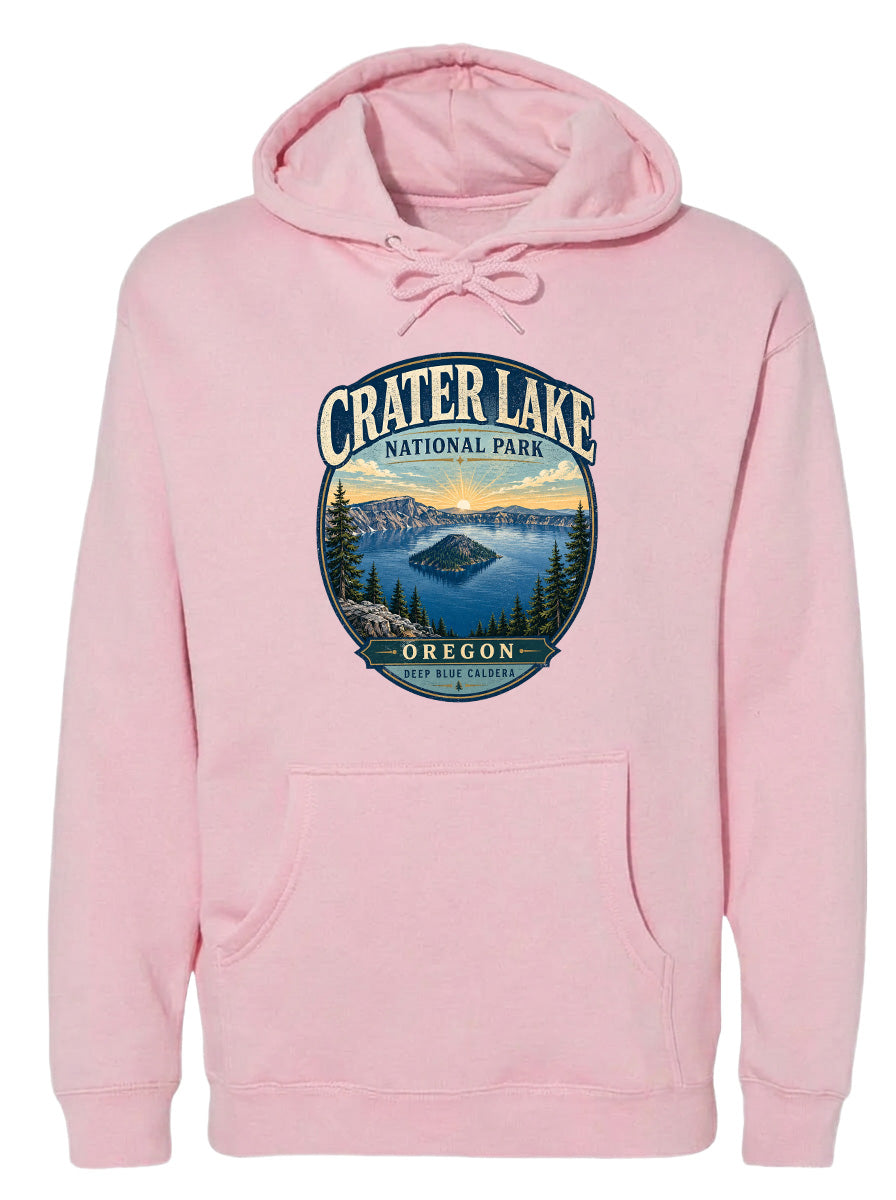 A pink hoodie with a graphic design depicting Crater Lake National Park in Oregon.