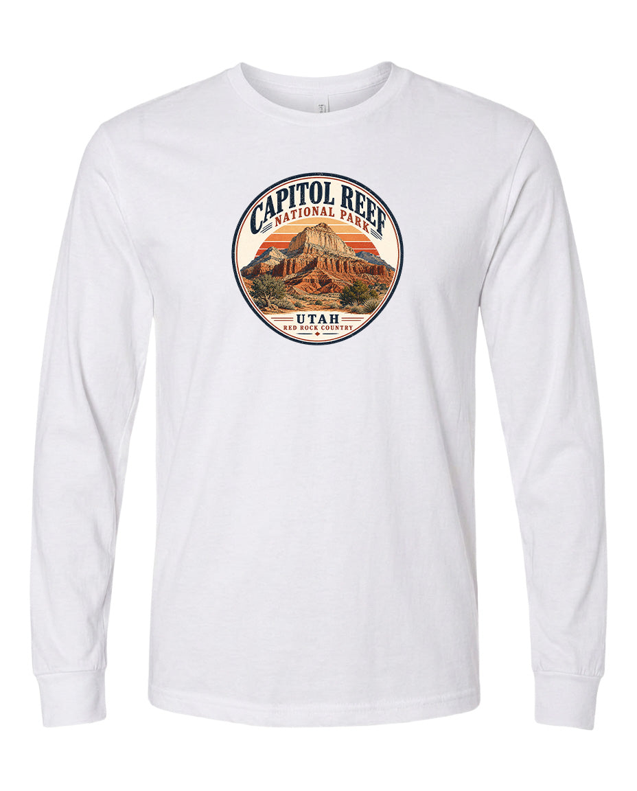 A white long-sleeved t-shirt with a circular design featuring the Capitol Reef National Park in Utah.