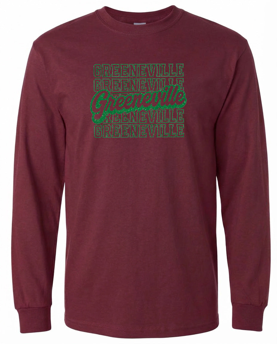 A burgundy long-sleeved t-shirt with a graphic design featuring the text "Greenville" repeated in a pattern across the front.