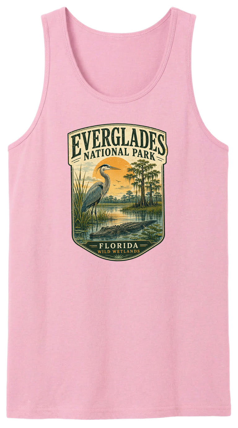 A pink tank top with a graphic design depicting Everglades National Park, featuring a bird, a sunset, and a body of water.