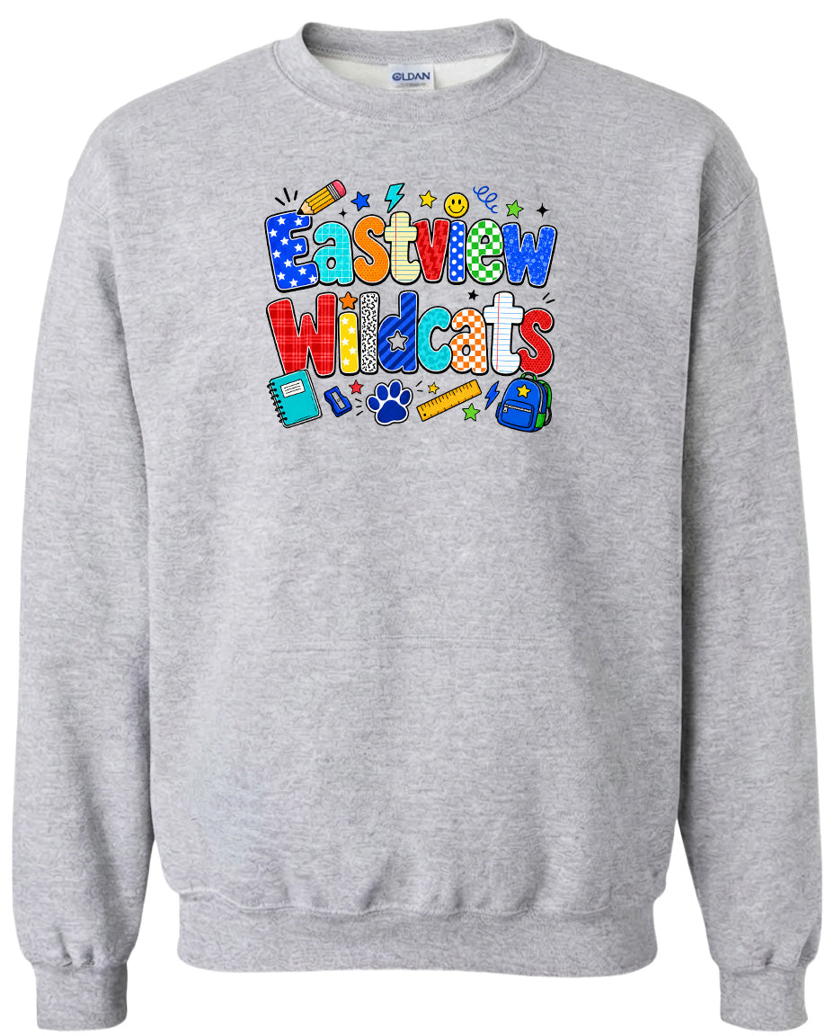 A gray sweatshirt with a colorful graphic design featuring the text "Eastview Wildcats" and various school-related icons such as a backpack, pencil, and book.