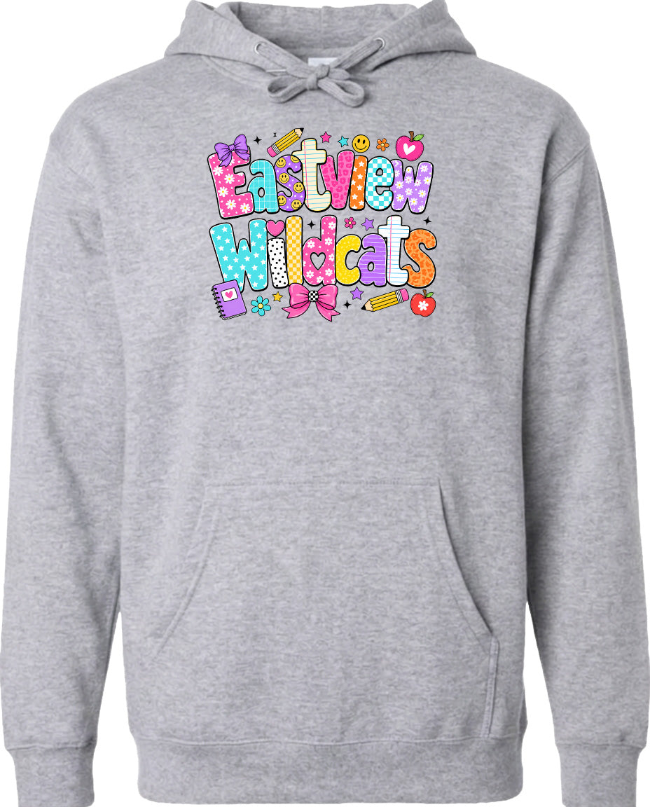 A gray hoodie with a colorful graphic design featuring the text "Eastview Wildcats" and various school-related icons such as pencils, books, and hearts.