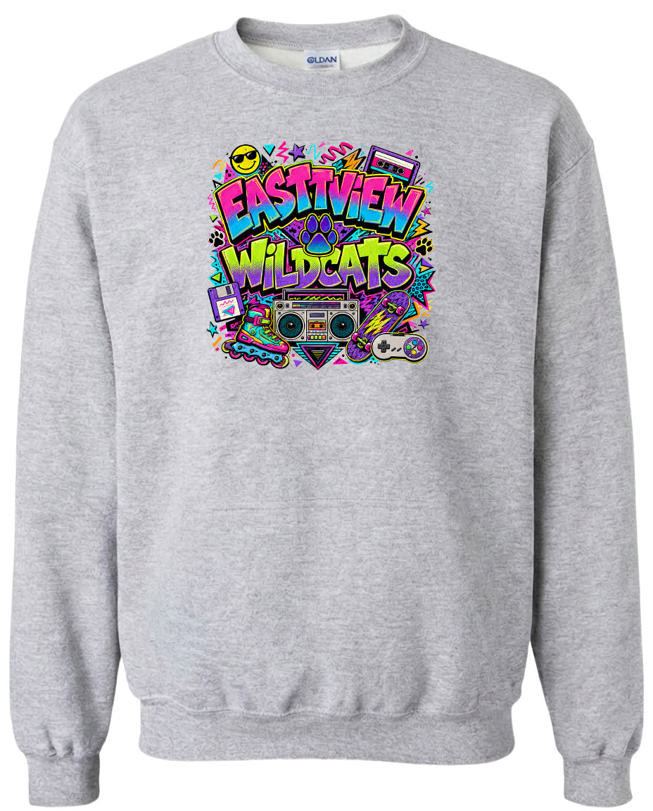 A gray sweatshirt with a colorful graphic design featuring the text "EASTVIEW WILDCATS" surrounded by various icons and elements, such as a boombox, a video game controller, and a retro-style camera.