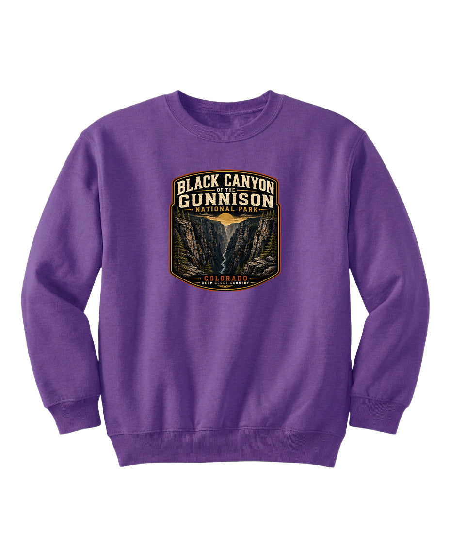 A purple sweatshirt with a graphic design depicting the Black Canyon of the Gunnison National Park.