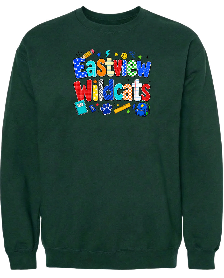 A dark green sweatshirt with a colorful graphic design featuring the text "Eastview Wildcats" and various school-related icons such as a backpack, pencil, and ruler.