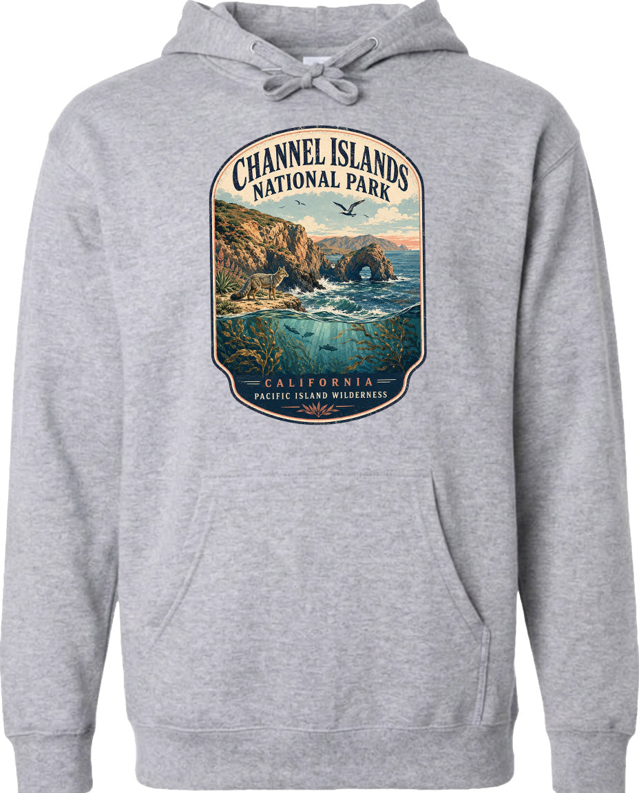 A gray hoodie with a graphic design depicting a scenic landscape featuring a rocky coastline, a waterfall, and a bird in flight.