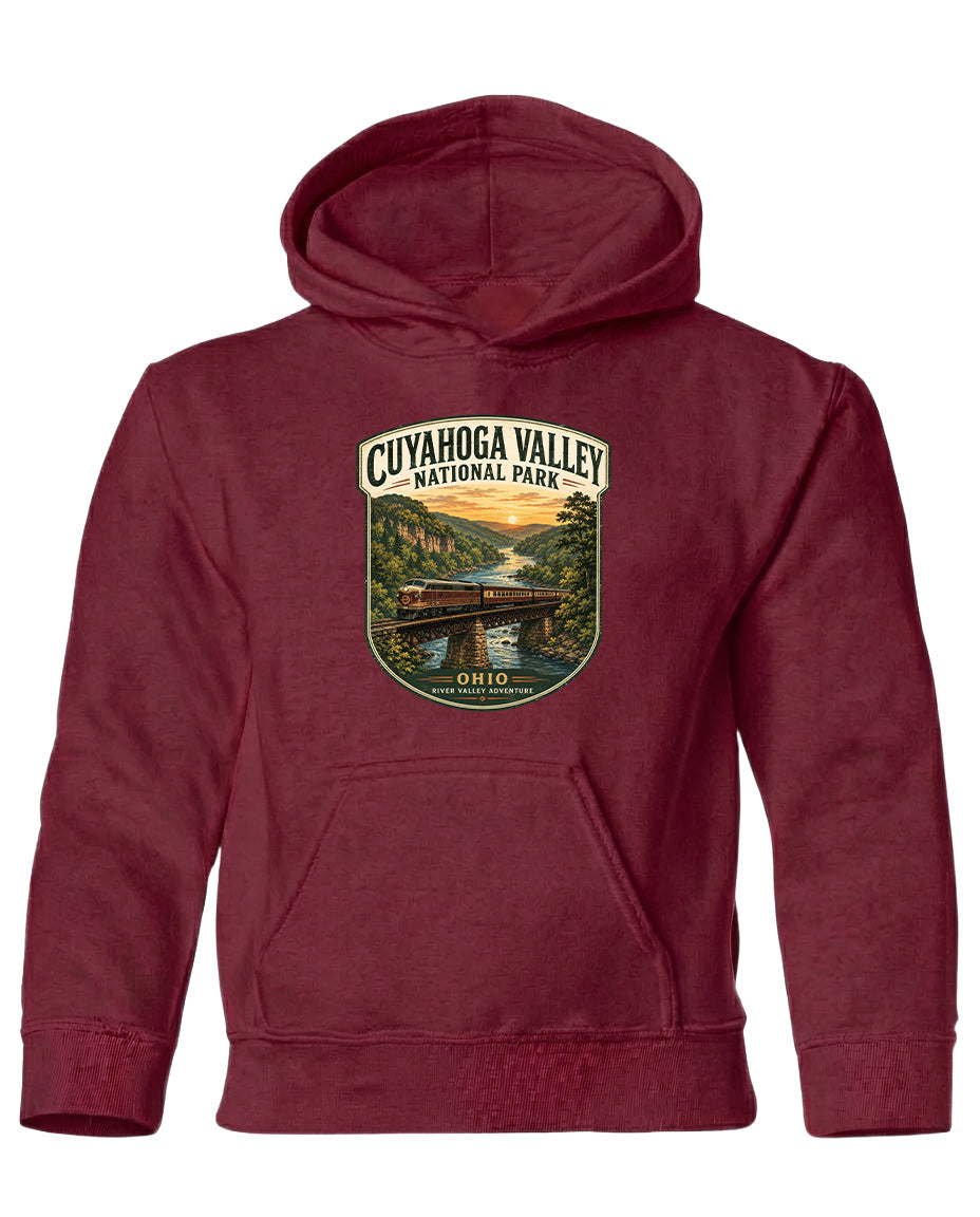 A red hooded sweatshirt with a graphic design depicting a scenic view of Cuyahoga Valley National Park, featuring a bridge and a river.
