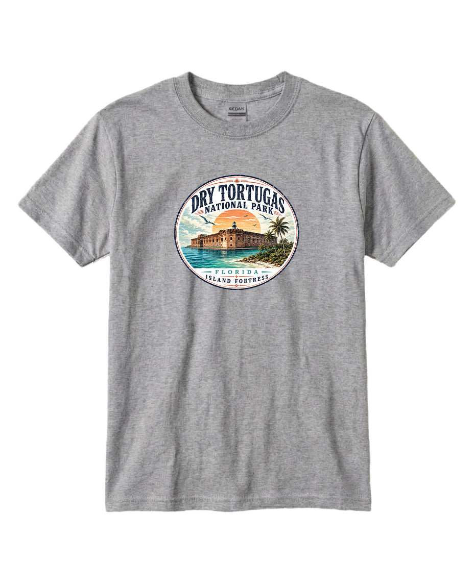 A gray t-shirt with a circular graphic design featuring a beach scene and a building, along with the text "Dry Tortugas National Park, Florida, Tortuga Island, Florida, Florida Coastline".