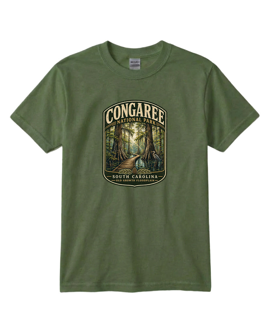 A green t-shirt with a graphic design depicting a forest scene with a path leading through it, surrounded by trees.