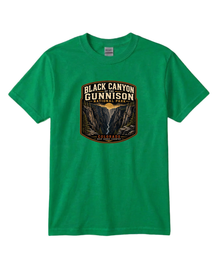 A green t-shirt with a graphic design depicting the Black Canyon of the Gunnison National Park.