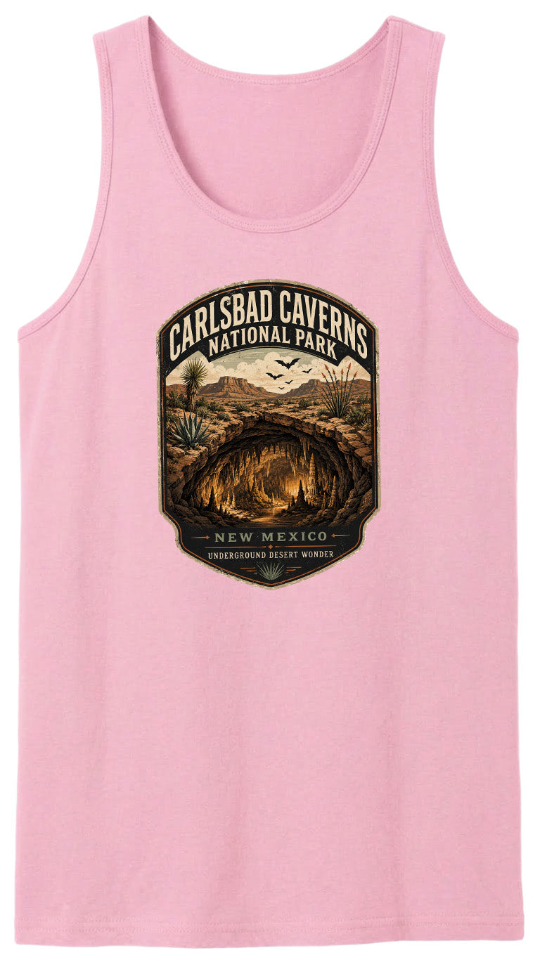 A pink tank top with a graphic design depicting the Carlsbad Caves National Park in New Mexico, featuring a desert landscape with a cave system and birds in flight.