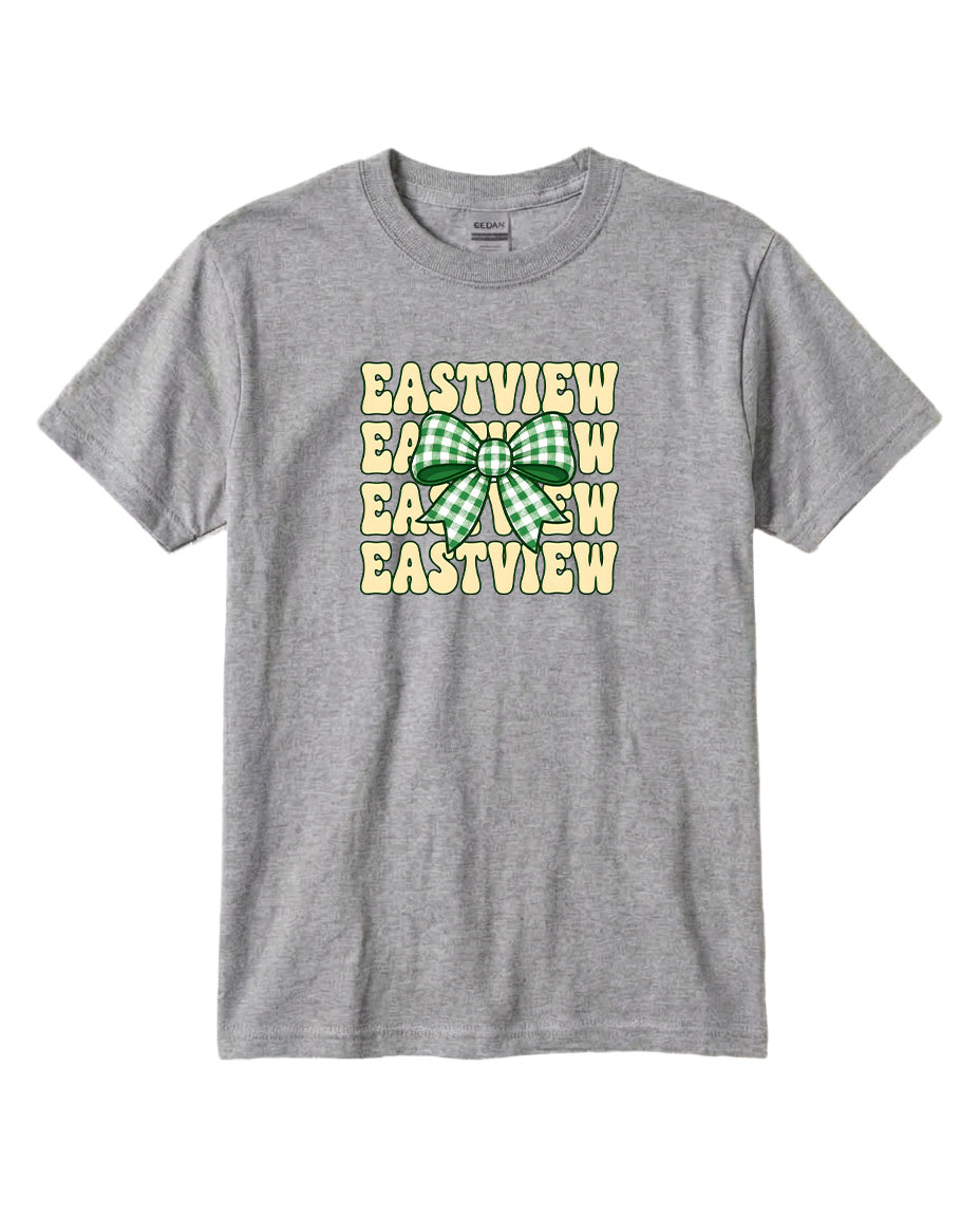 A gray t-shirt with a graphic design featuring a green and white bow and the text "EASTVIEW" repeated multiple times in a checkered pattern.