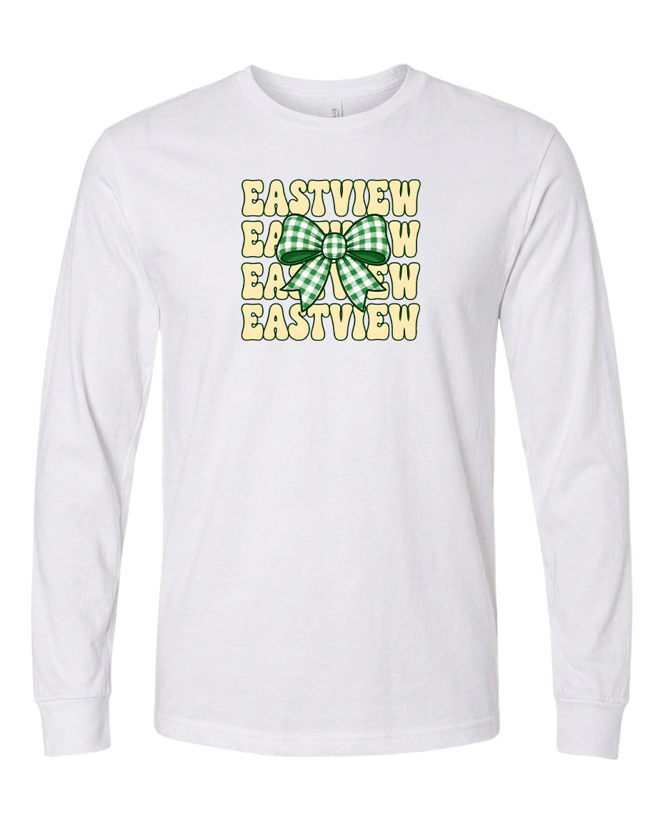 A white long-sleeved t-shirt with a graphic design featuring a green and white bow and the text "EASTVIEW" repeated multiple times in a vertical arrangement.