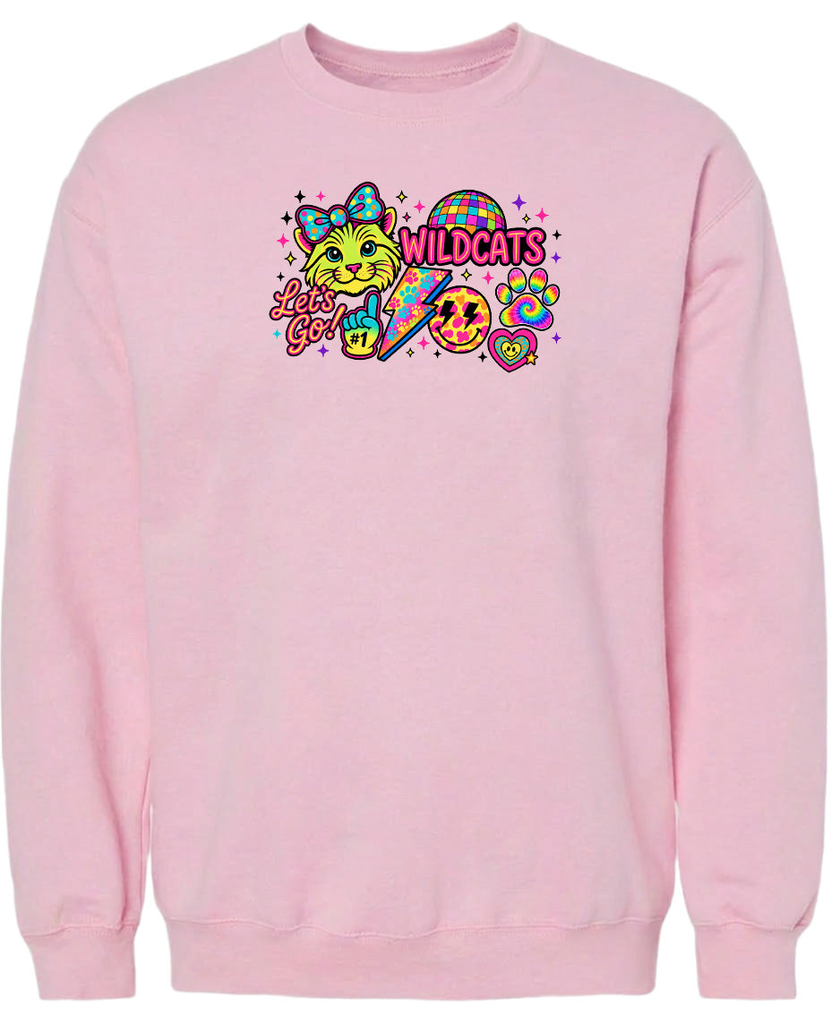 A pink sweatshirt with a colorful graphic design featuring a cat, a rainbow, and various other elements.