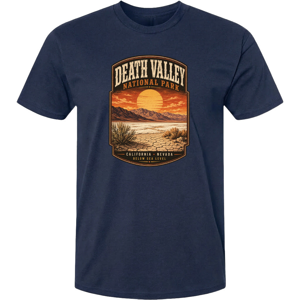 A graphic t-shirt design featuring a desert landscape with mountains, a sunset, and the text "DEATH VALLEY NATIONAL PARK CALIFORNIA NEVADA BELOW SEA LEVEL".