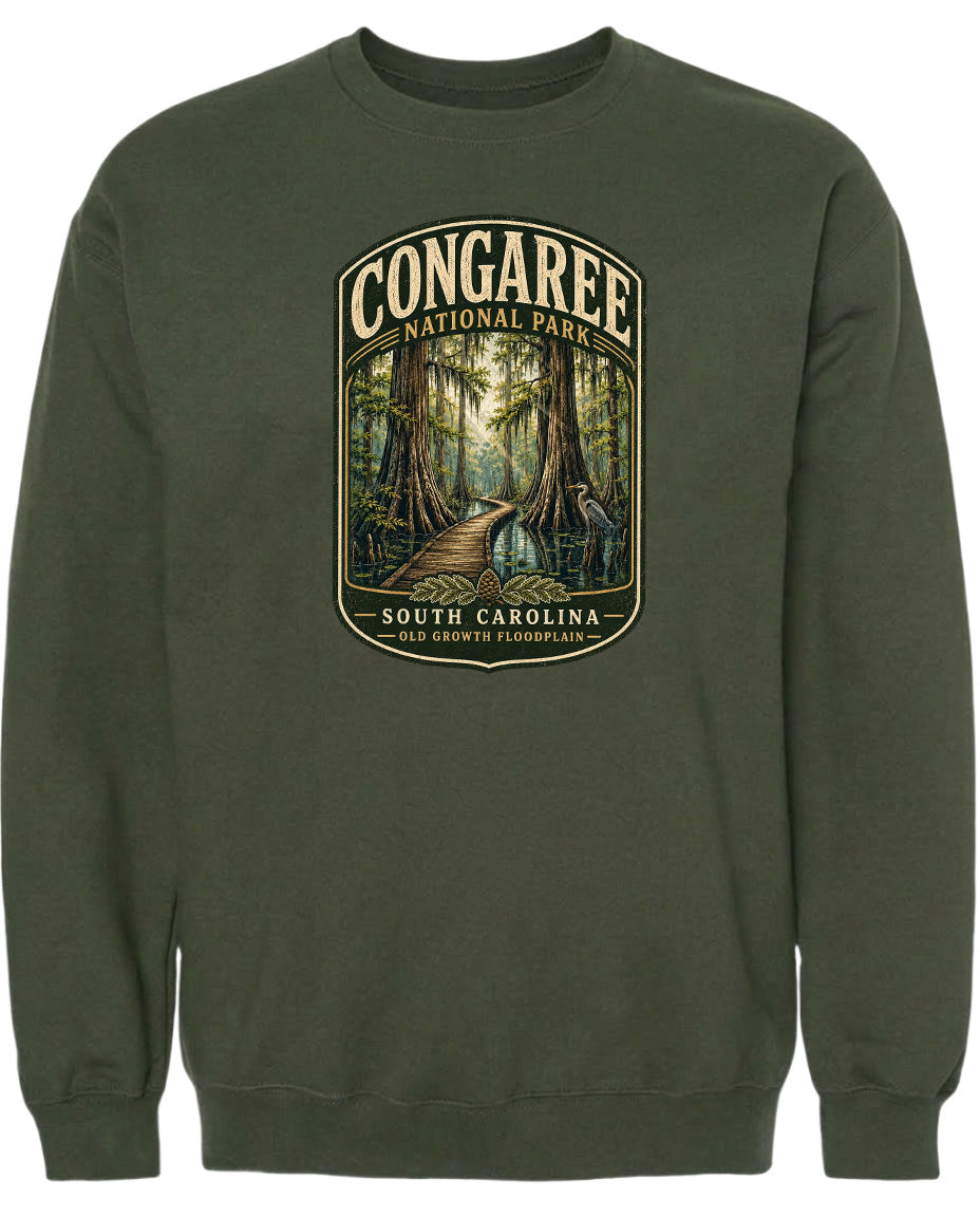 A green sweatshirt with a graphic design depicting a forest scene with a path leading through it.