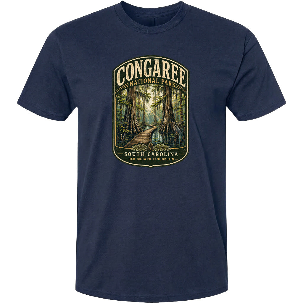 A navy blue t-shirt with a graphic design depicting a forest scene with a path leading through it.