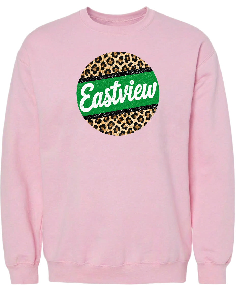 A pink sweatshirt with a circular logo on the front. The logo features a green and leopard print design, and the word "Eastview" written in white text.