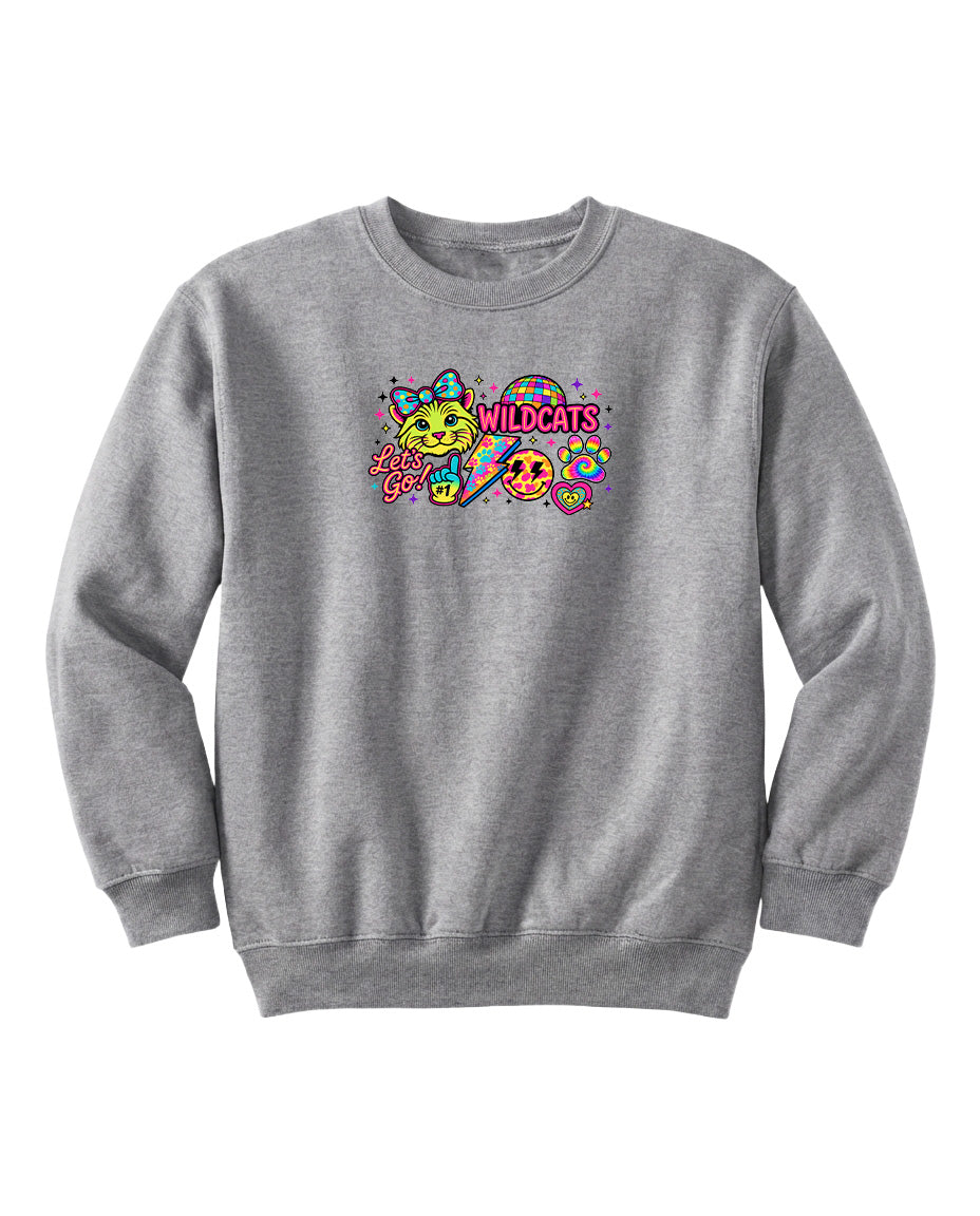 A gray sweatshirt with a colorful graphic design featuring a smiling face, a cat, and the text "WILDCATS" in a playful font.