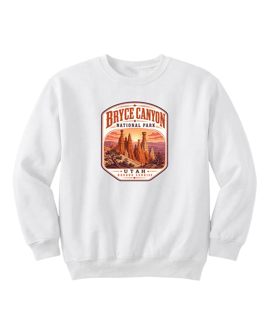 A white sweatshirt with a graphic design depicting Bryce Canyon National Park and Utah.