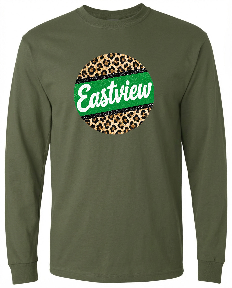 A long-sleeved olive green t-shirt with a circular graphic design on the front. The design consists of a leopard print pattern surrounding a green stripe, and the word "Eastview" is written in white cursive letters.