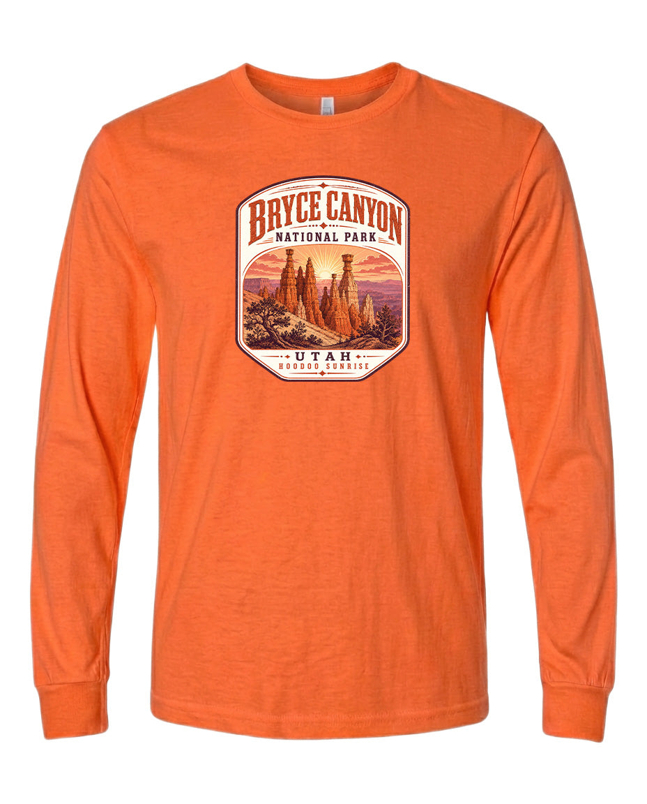 a long-sleeved orange t-shirt with a graphic design depicting the Bryce Canyon National Park in Utah.
