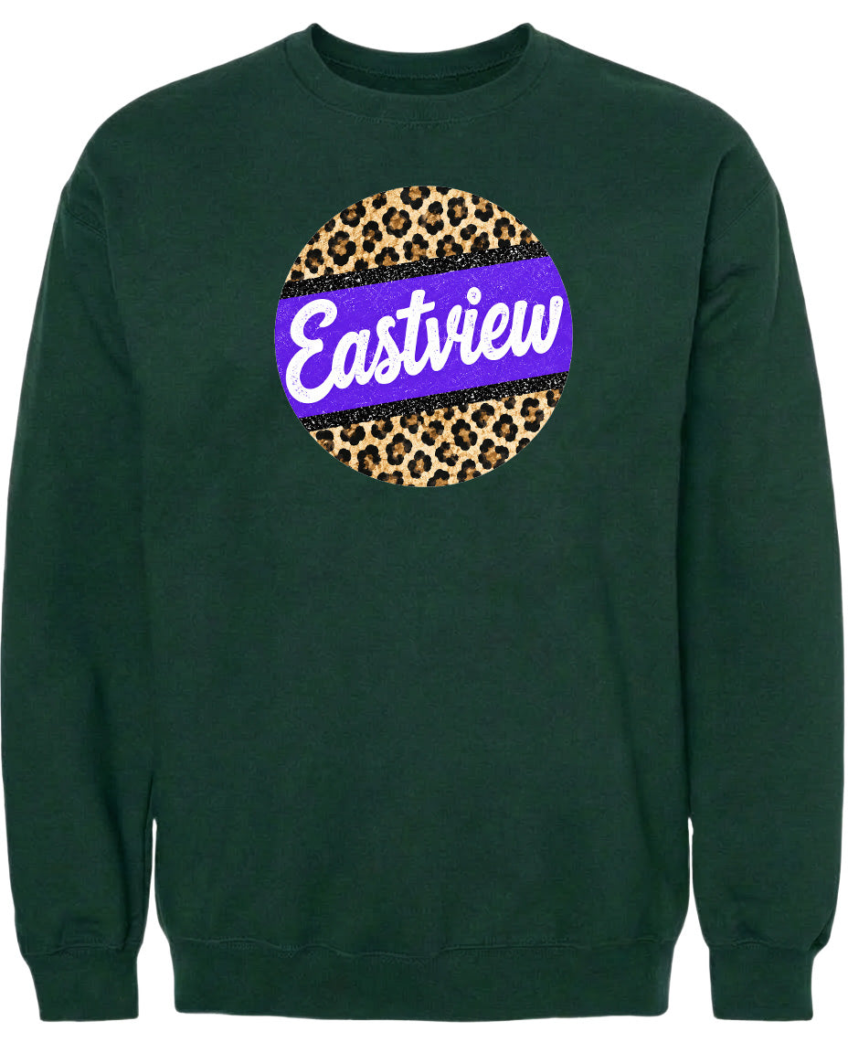 A dark green sweatshirt with a large purple and leopard print circle on the front.