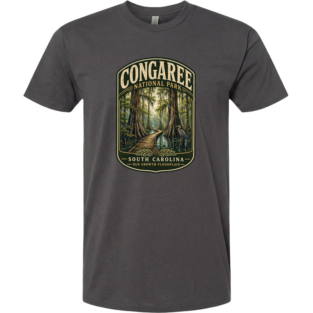 A gray t-shirt with a graphic design depicting a forest scene with a path leading through it, surrounded by trees and foliage.