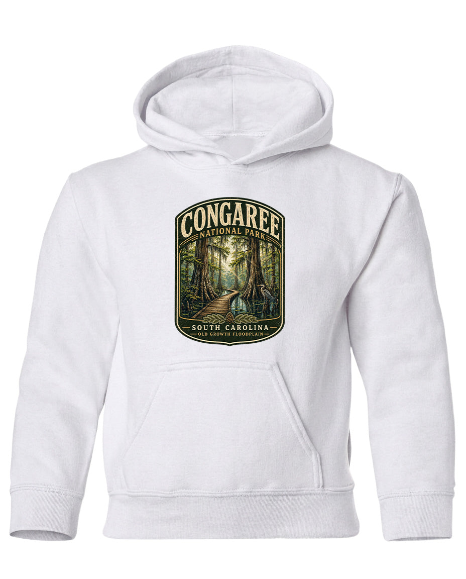 A white hoodie with a graphic design depicting a forest scene with a path leading through it.