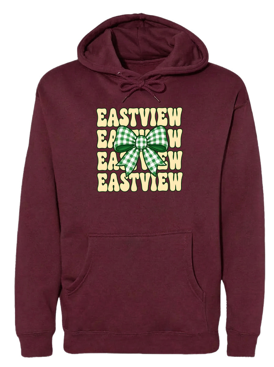A burgundy hoodie with a graphic design featuring a green and white bow on the front.