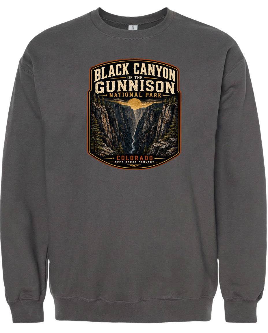 A gray sweatshirt with a graphic design depicting the Black Canyon of the Gunnison National Park in Colorado.