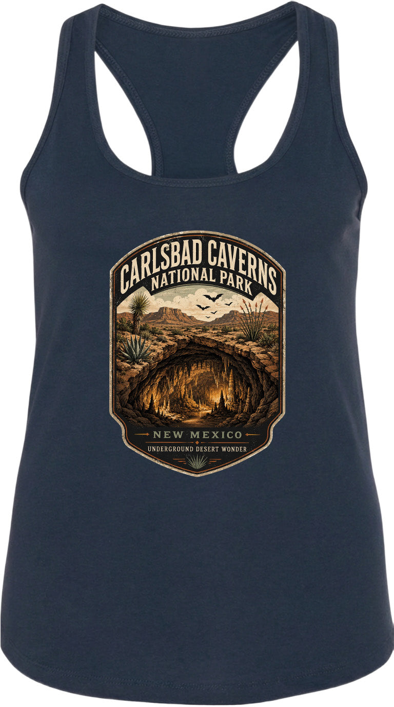 A graphic design on a dark blue tank top featuring a desert landscape with a cave, mountains, and birds in the sky.