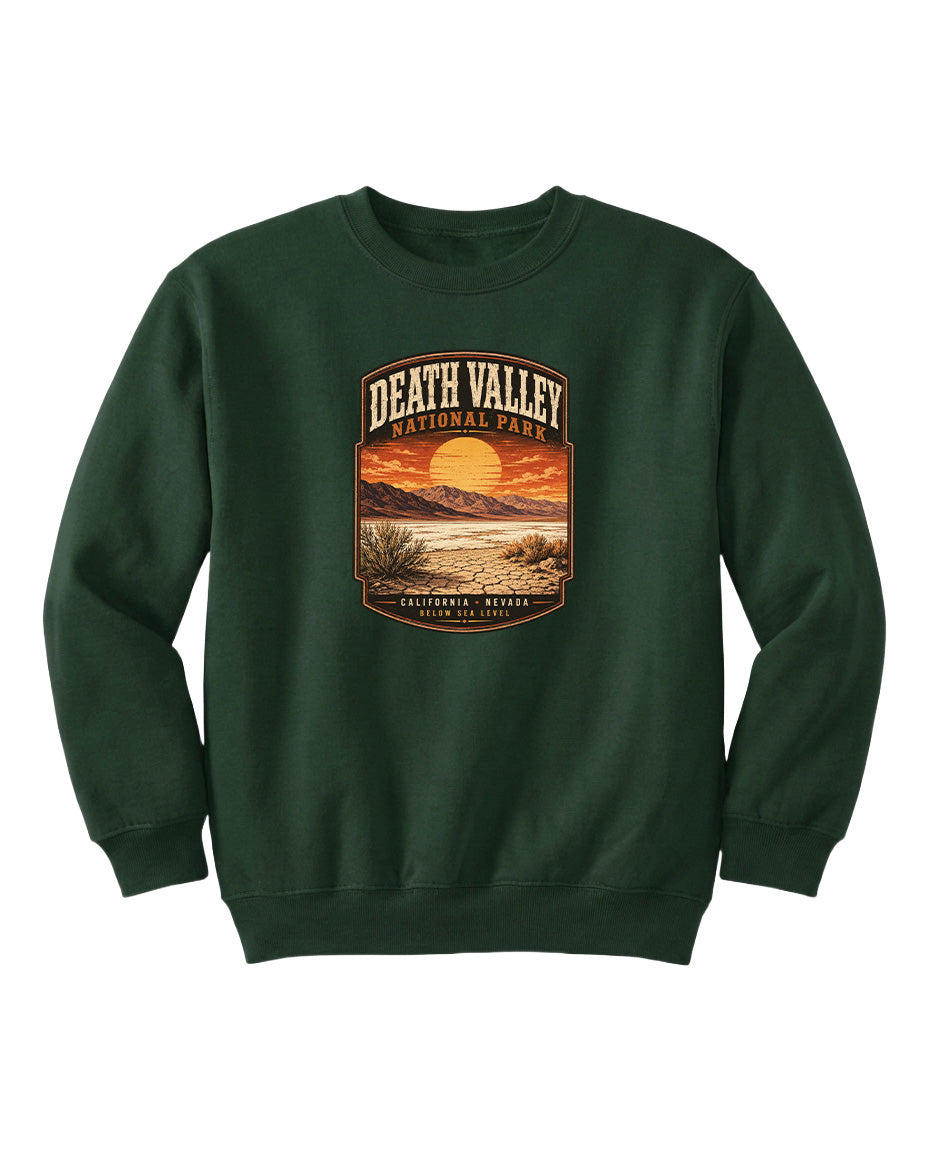 A green sweatshirt with a graphic design depicting a sunset over Death Valley National Park.