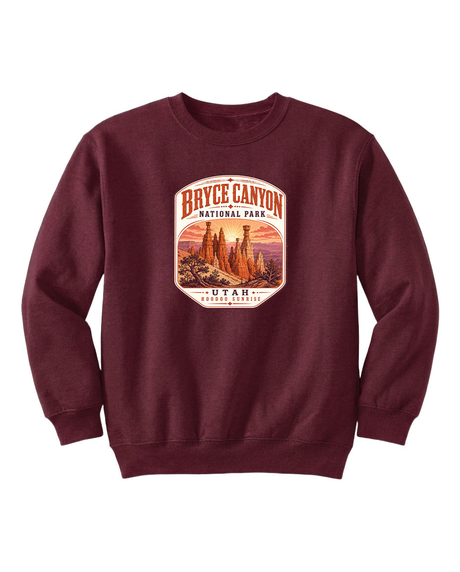 A burgundy-colored sweatshirt with a graphic design depicting Bryce Canyon National Park and Utah.