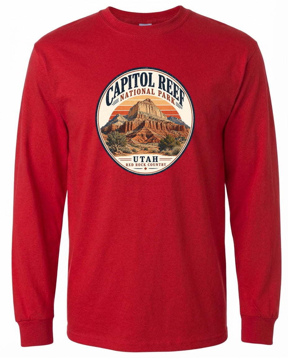 A red long-sleeved t-shirt with a circular design featuring the Capitol Reef National Park in Utah.