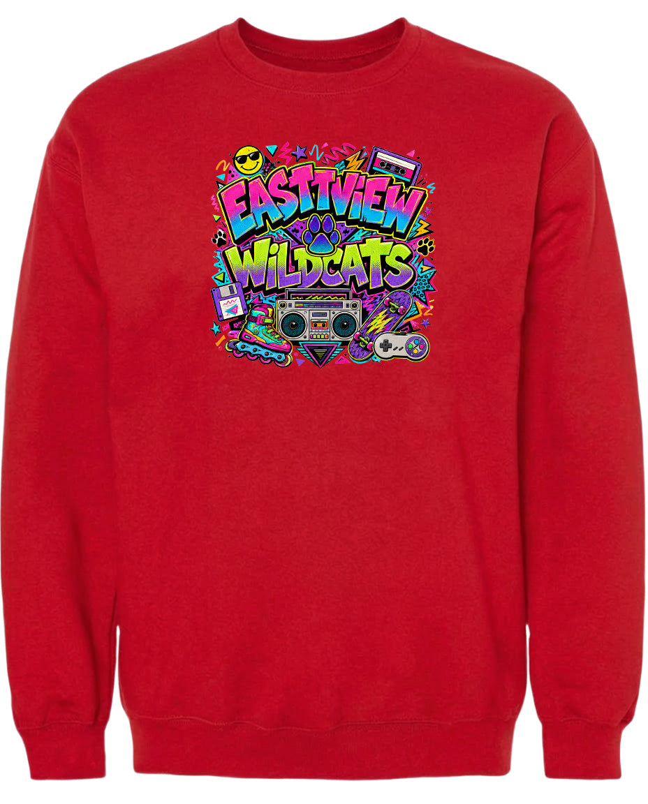 A red sweatshirt with a colorful graphic design featuring the text "EASTVIEW WILDCATS" surrounded by various icons and symbols, such as a boombox, cassette tape, and other retro-style elements.