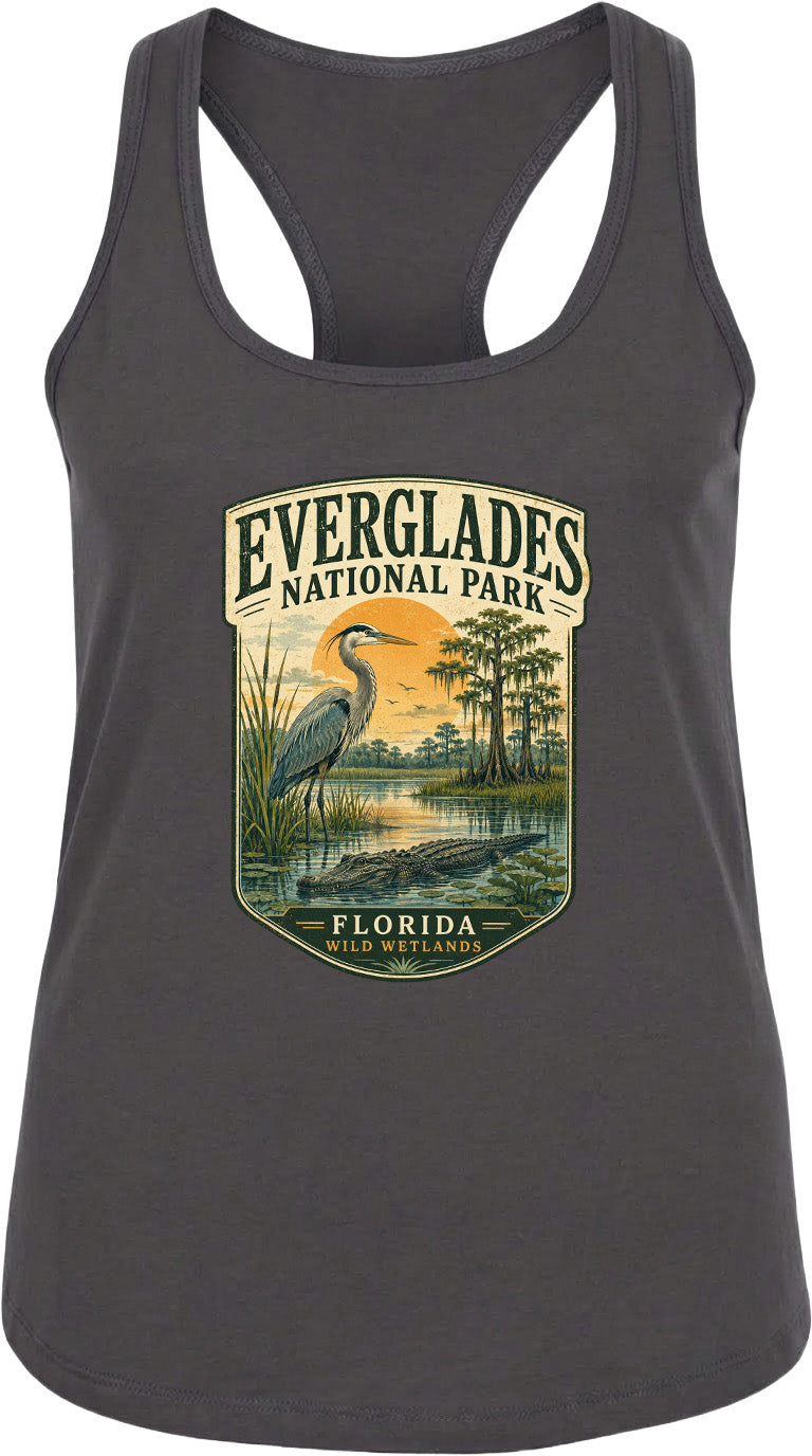 A gray tank top with a graphic design depicting a bird standing in a pond surrounded by trees and a sunset.