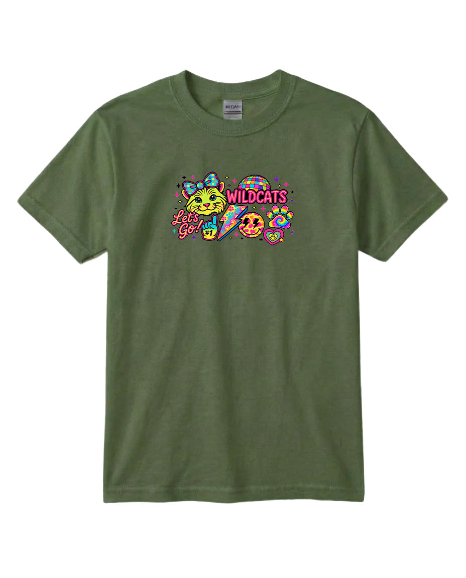 A green t-shirt with a colorful graphic design featuring a smiling face, a cat, and the text "Wildcats" in pink and yellow.