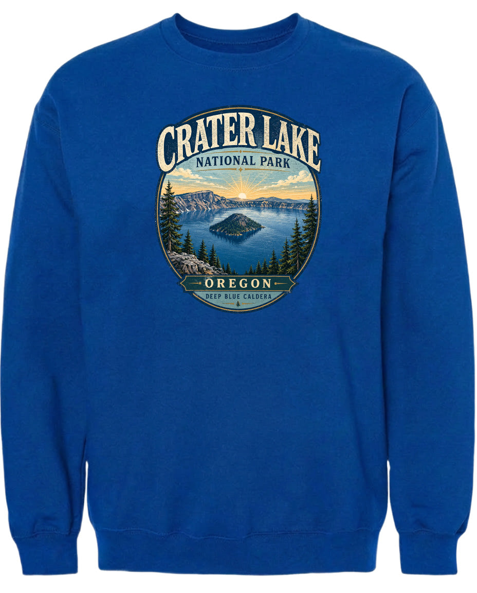A blue sweatshirt with a graphic design depicting Crater Lake National Park in Oregon.