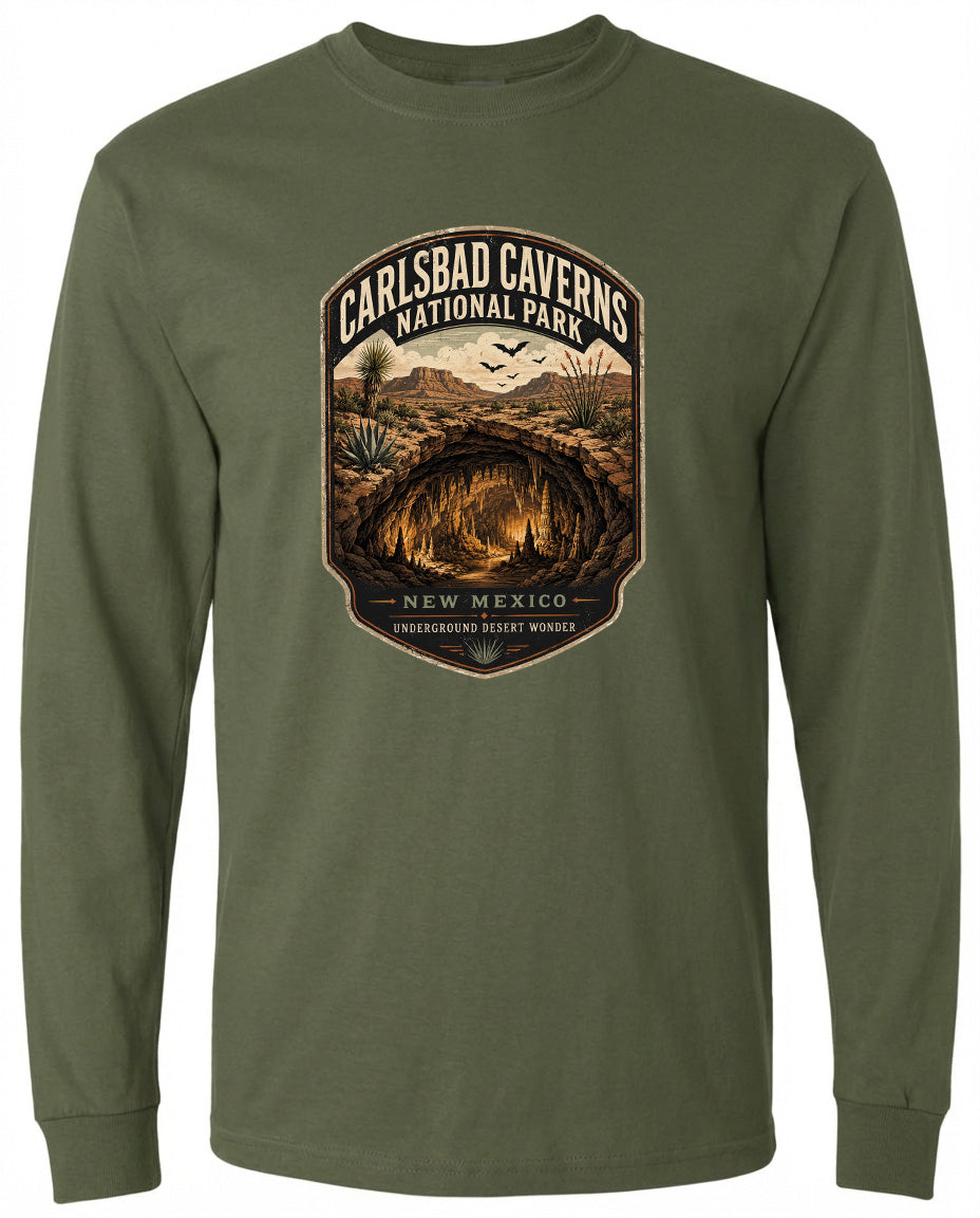A long-sleeved green t-shirt with a graphic design depicting the entrance to the Carlsbad Caves National Park in New Mexico.