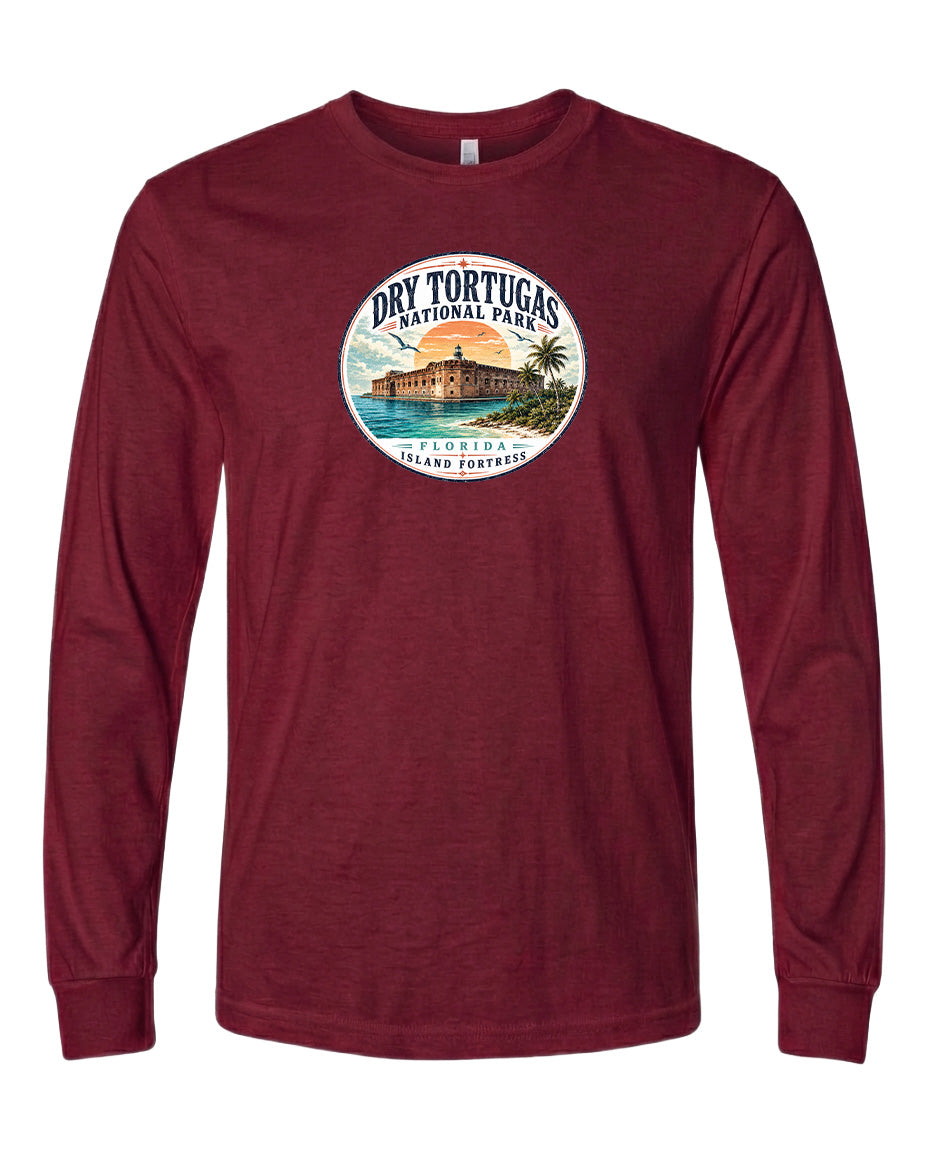 A red long-sleeved t-shirt with a circular design featuring a tropical island and palm trees, along with the text "Dry Tortugas National Park, Florida, USA".