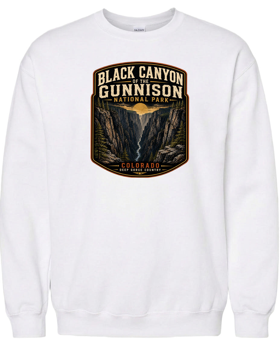 A white sweatshirt with a graphic design depicting the Black Canyon of the Gunnison National Park in Colorado.