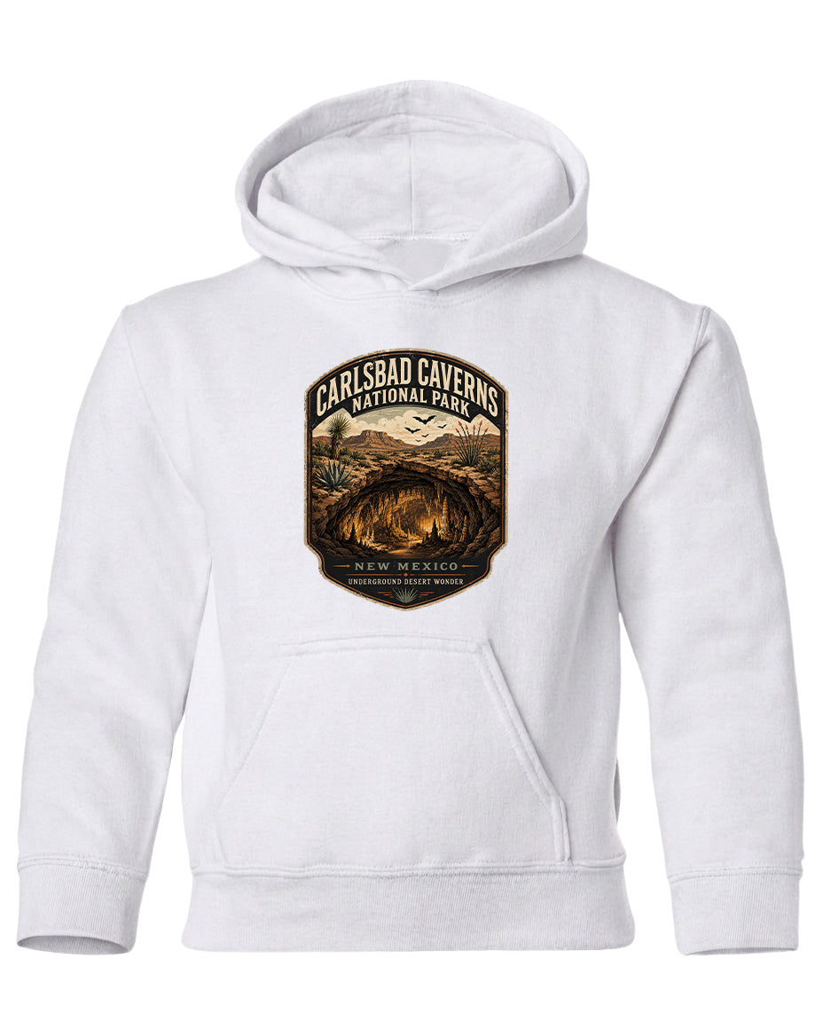 A white hoodie with a graphic design featuring a desert landscape and the text "CARLSBAD CAVENS NATIONAL PARK" printed on it.