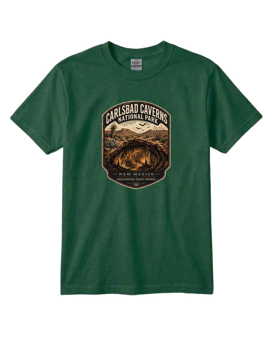 A green t-shirt with a graphic design depicting the entrance to Carlsbad Caverns National Park in New Mexico.