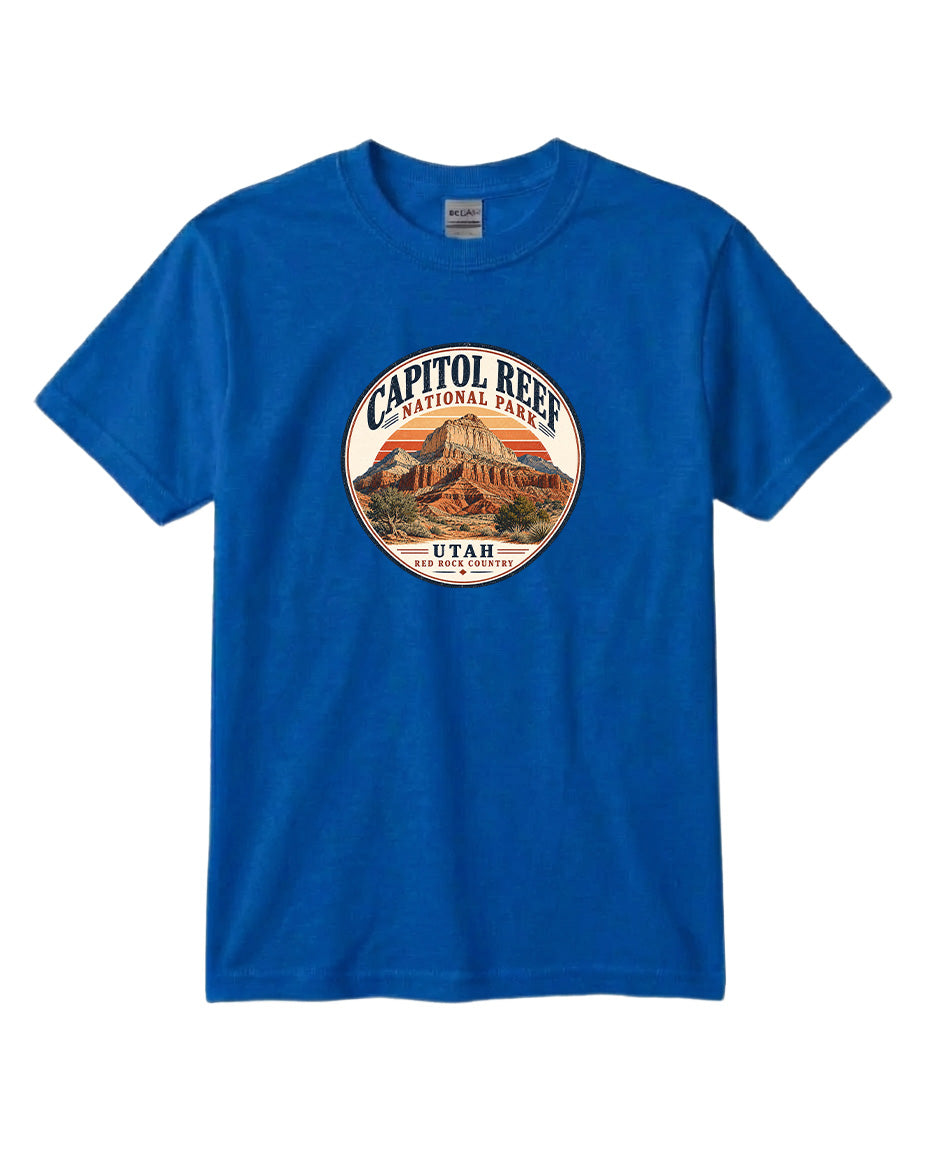 A blue t-shirt with a circular graphic design featuring the Capitol Reef National Park in Utah.