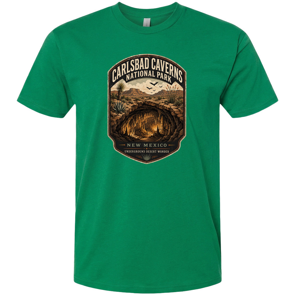 A green t-shirt with a graphic design depicting the entrance to Carlsbad Caverns National Park in New Mexico.