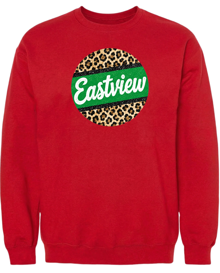 A red sweatshirt with a green and leopard print circular logo on the front.